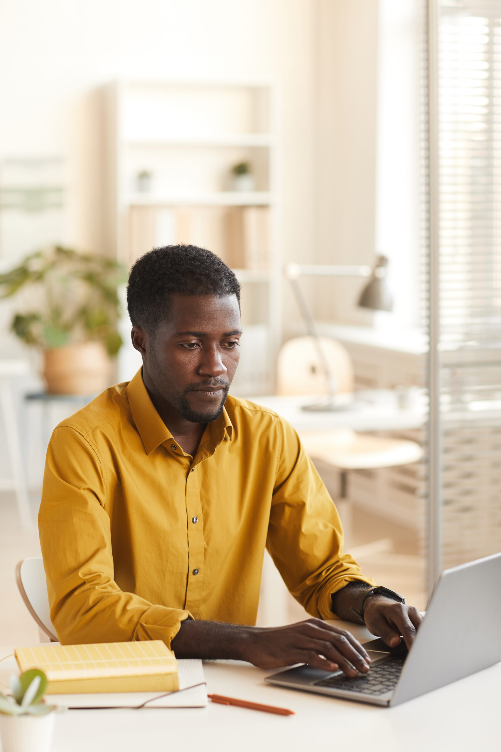 african american man using laptop in office 2021 09 24 04 12 53 utc scaled.jpg