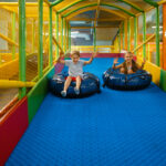 children rides on tubing, entertainment center