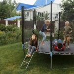 full shot kids jumping trampoline
