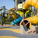 girl at the large beautiful playground in the park