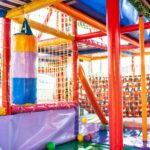 outdoor playground with colorful mats
