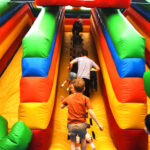 rear view many children climb the slide on a color 2023 11 27 04 50 21 utc